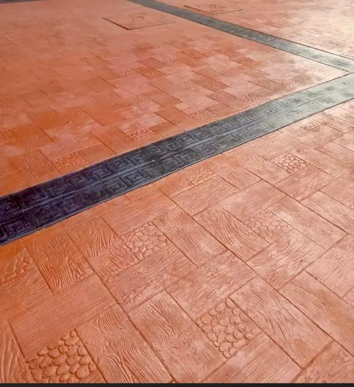 Interlocking paving stones being laid on a compound driveway