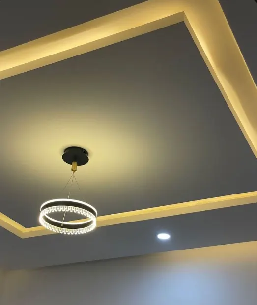 POP ceiling with recessed cove lighting in a living room